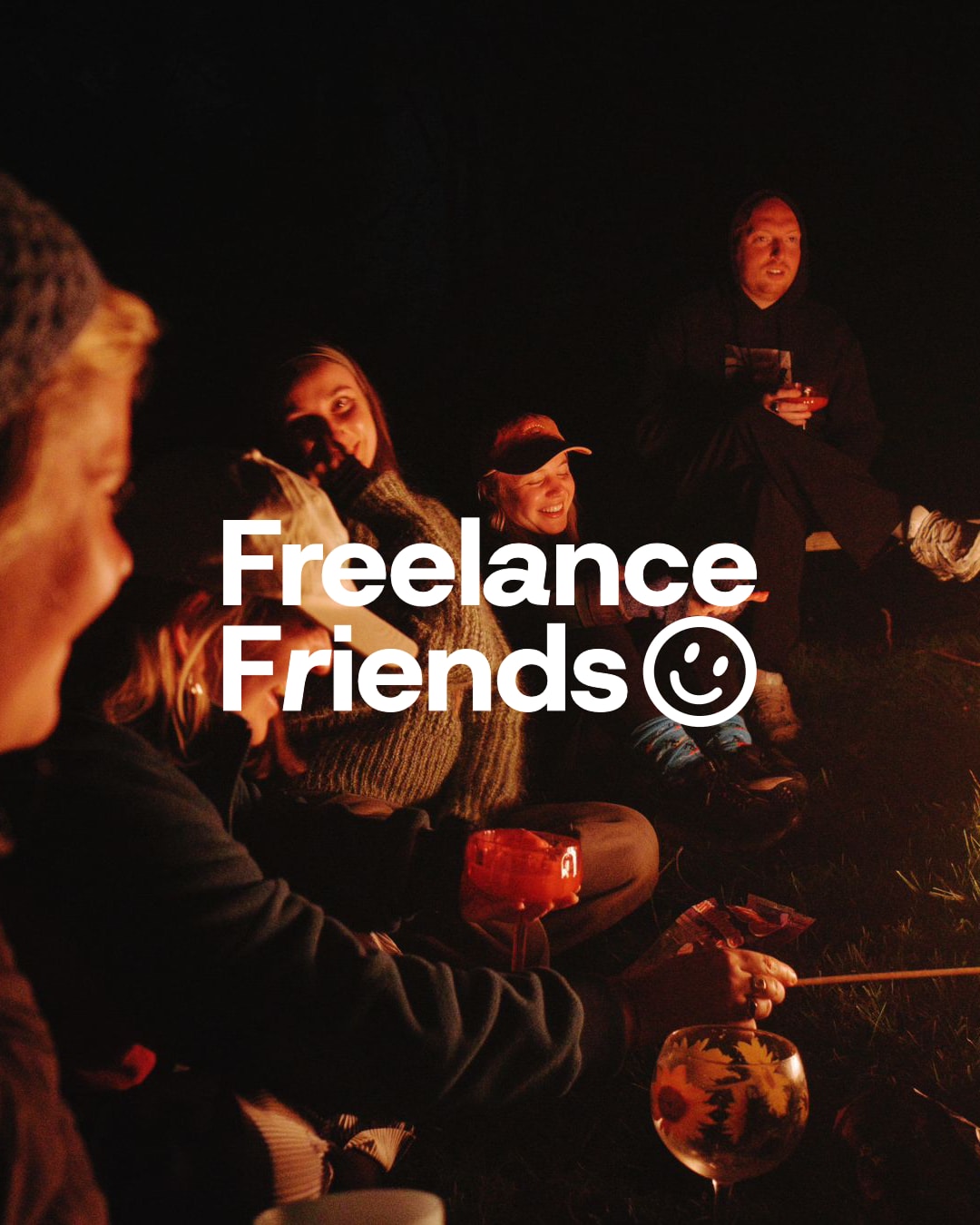 The Freelance Friends wordmark over members around a campfire