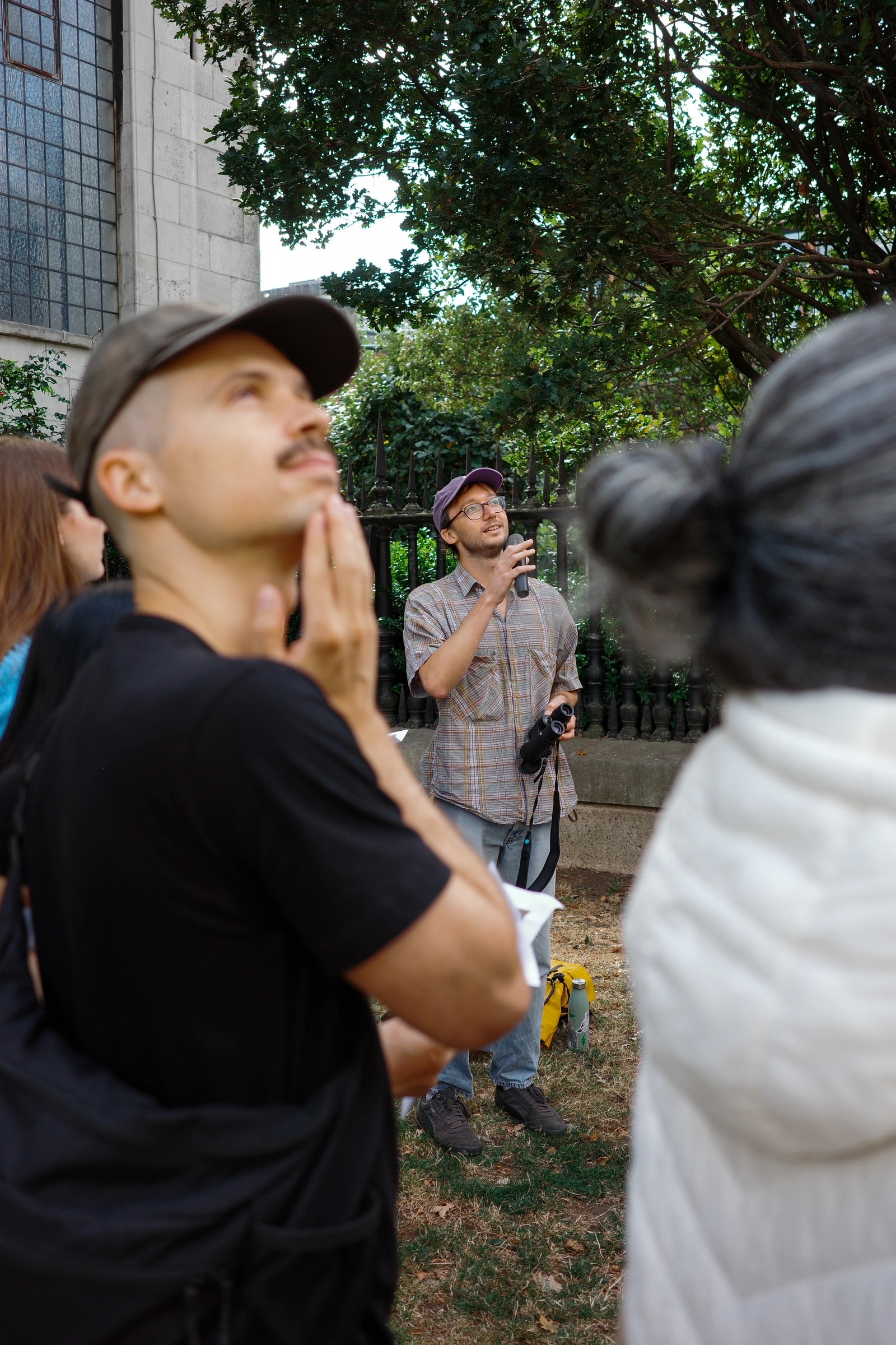 A man looking up during a Just Looking photography walk