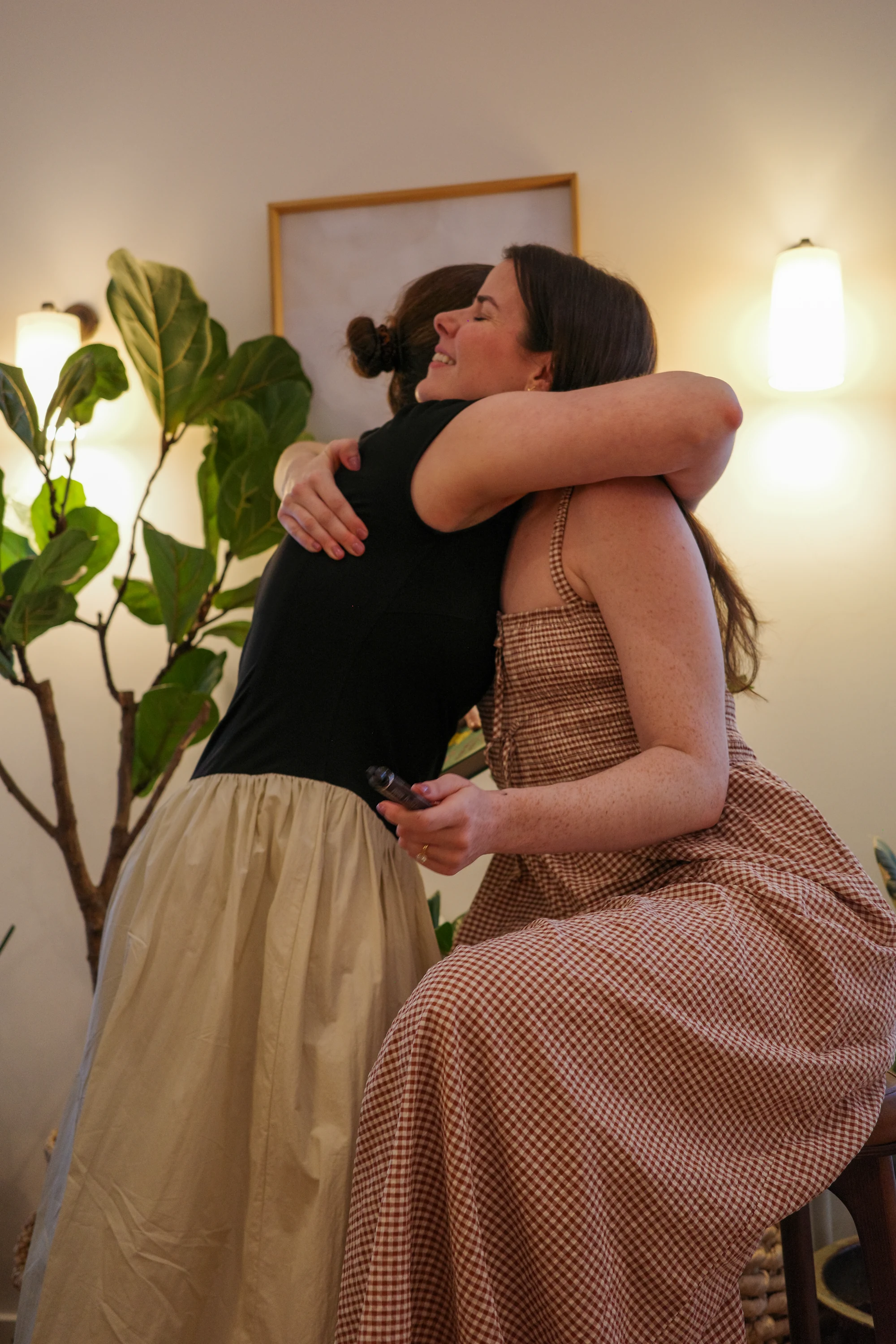 Two women embracing at The Hearth